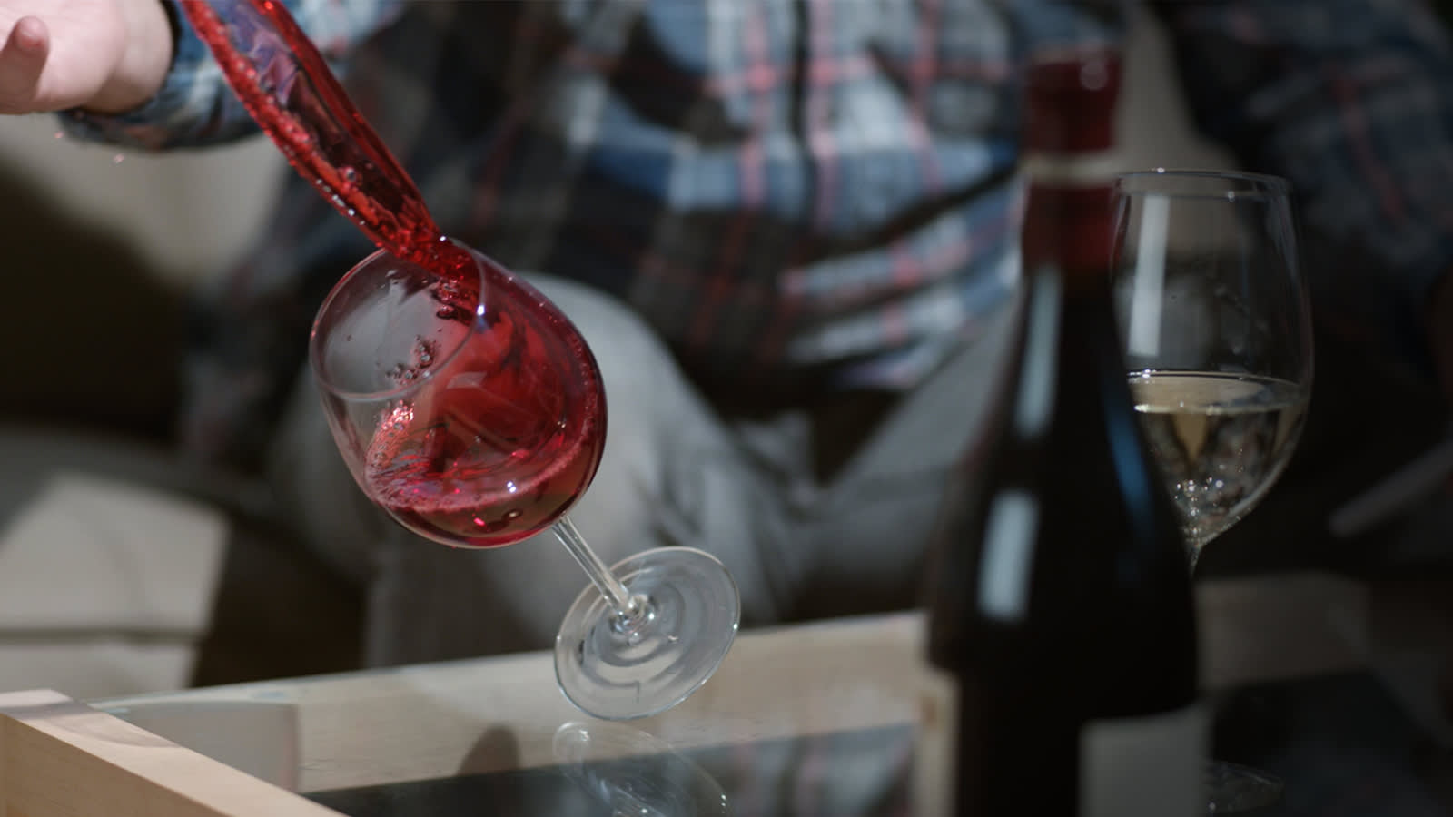 Red wine spilling out of glass
