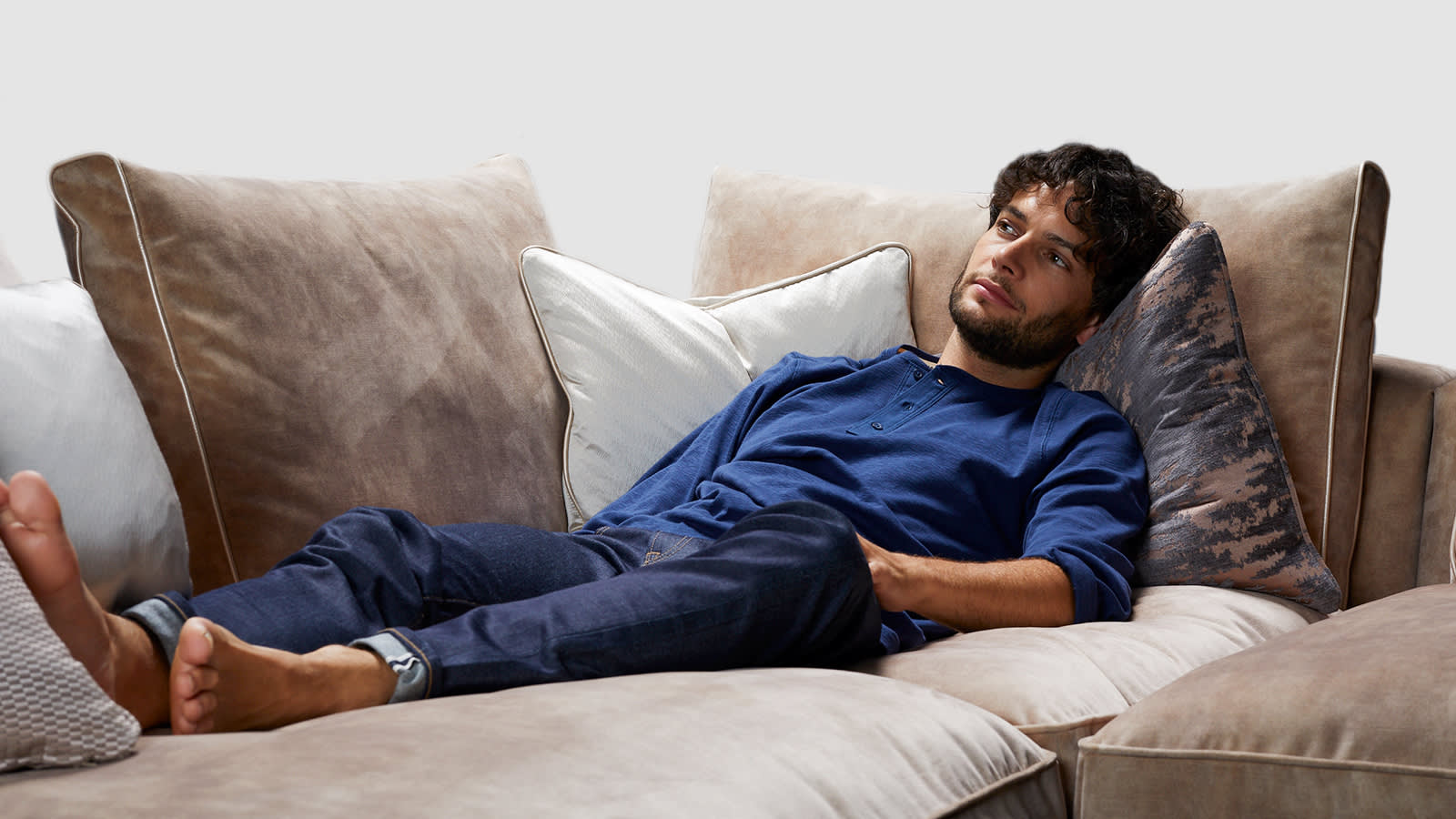 Man relaxing on the Emperor sofa