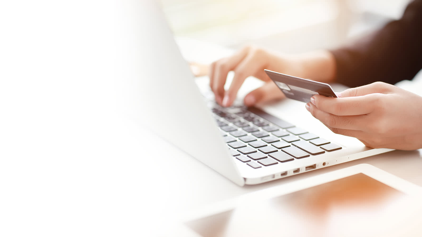 Entering credit card information on a laptop