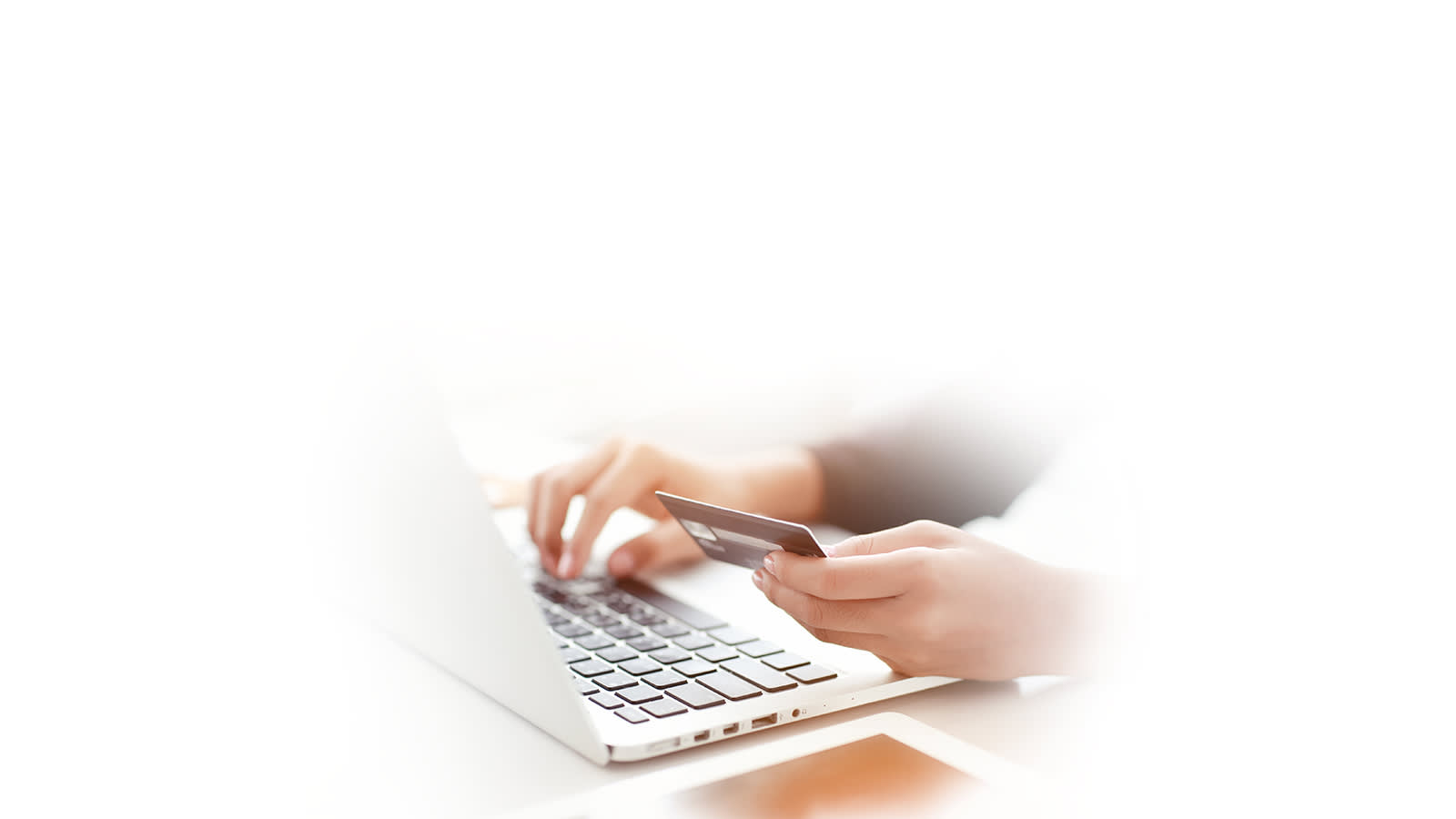 Entering credit card information on a laptop