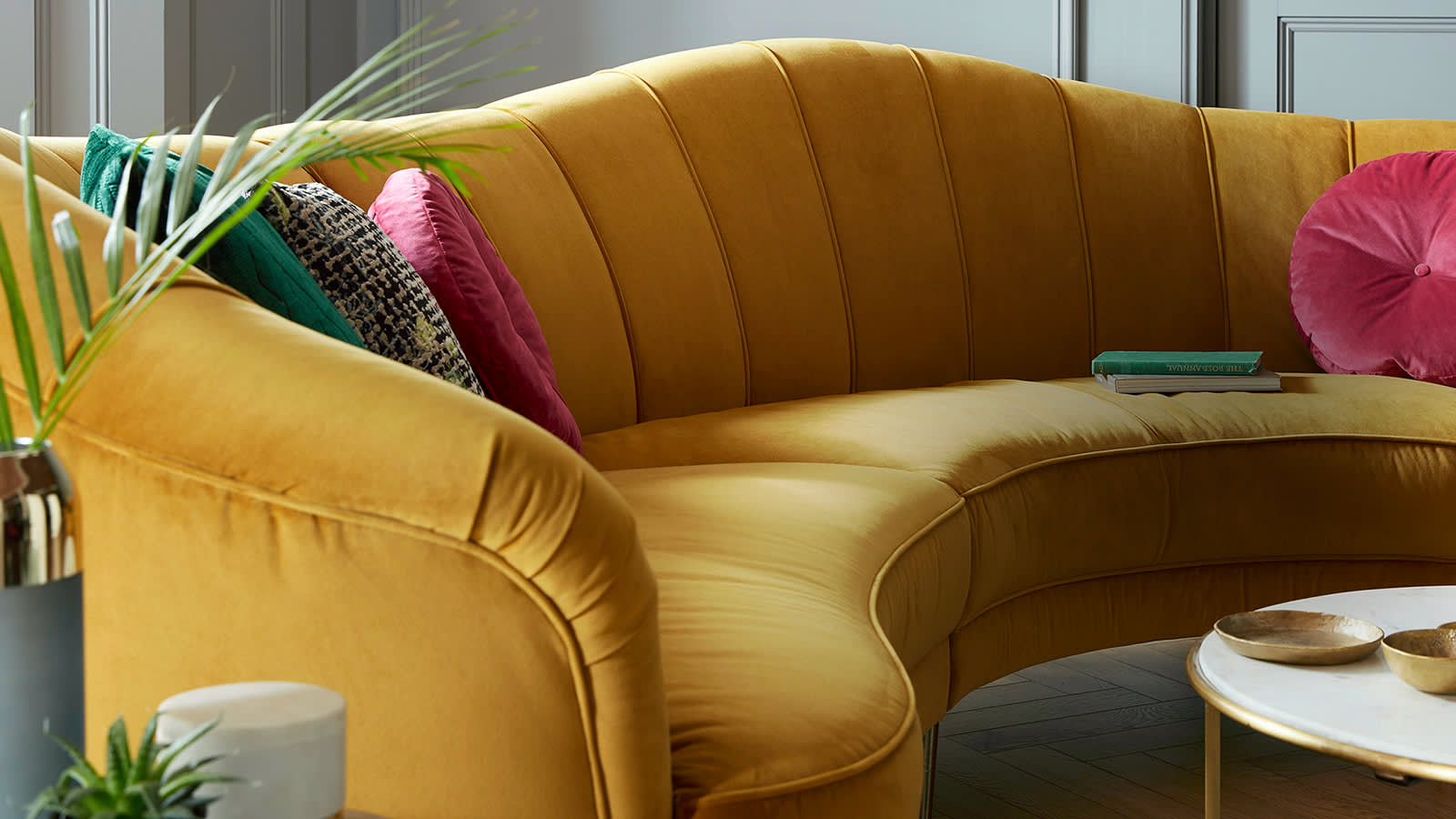 Perle yellow curved corner with pink, green and patterned scatter cushions