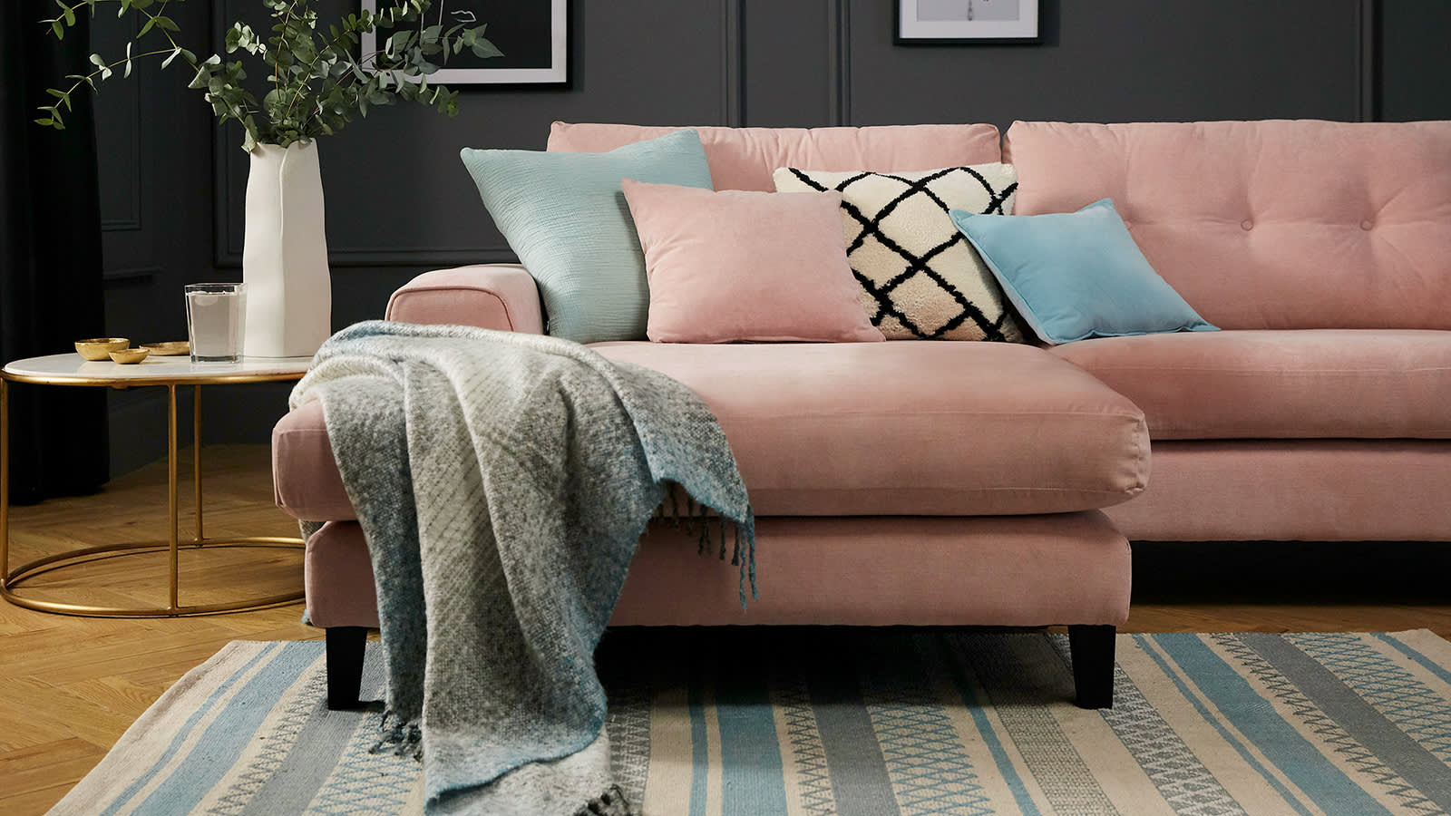 Light pink Demure chaise sofa with light blue throw and scatter cushions
