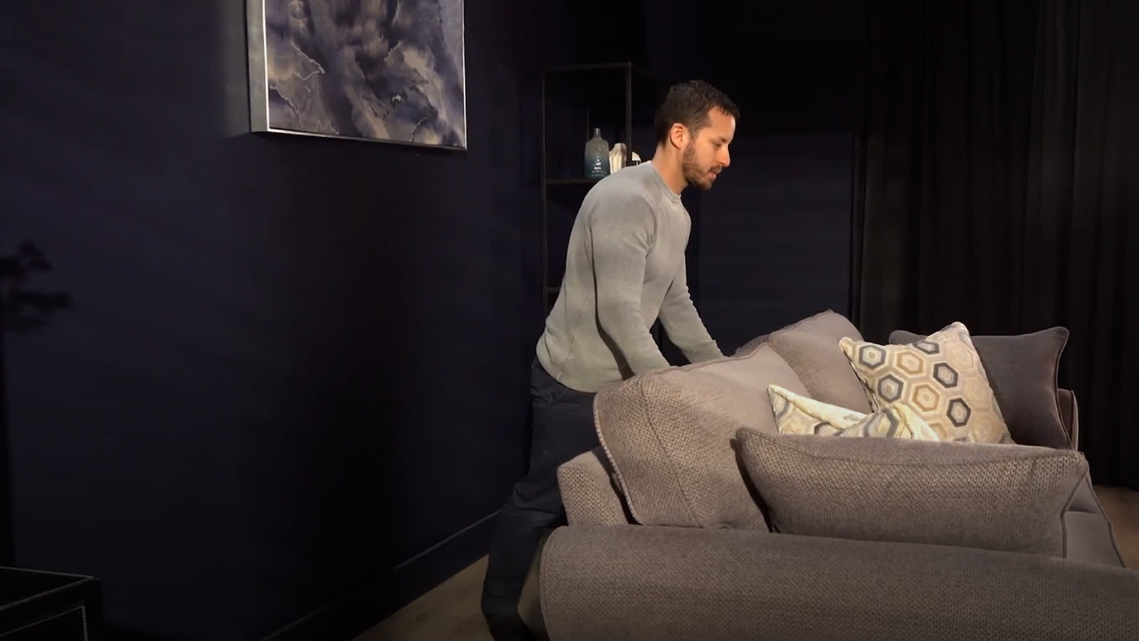 Man pushing a sofa using sofaglide