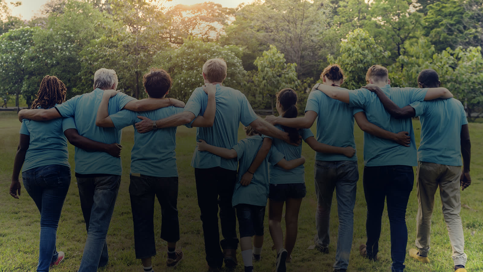 Line of people with arms around each others shoulders