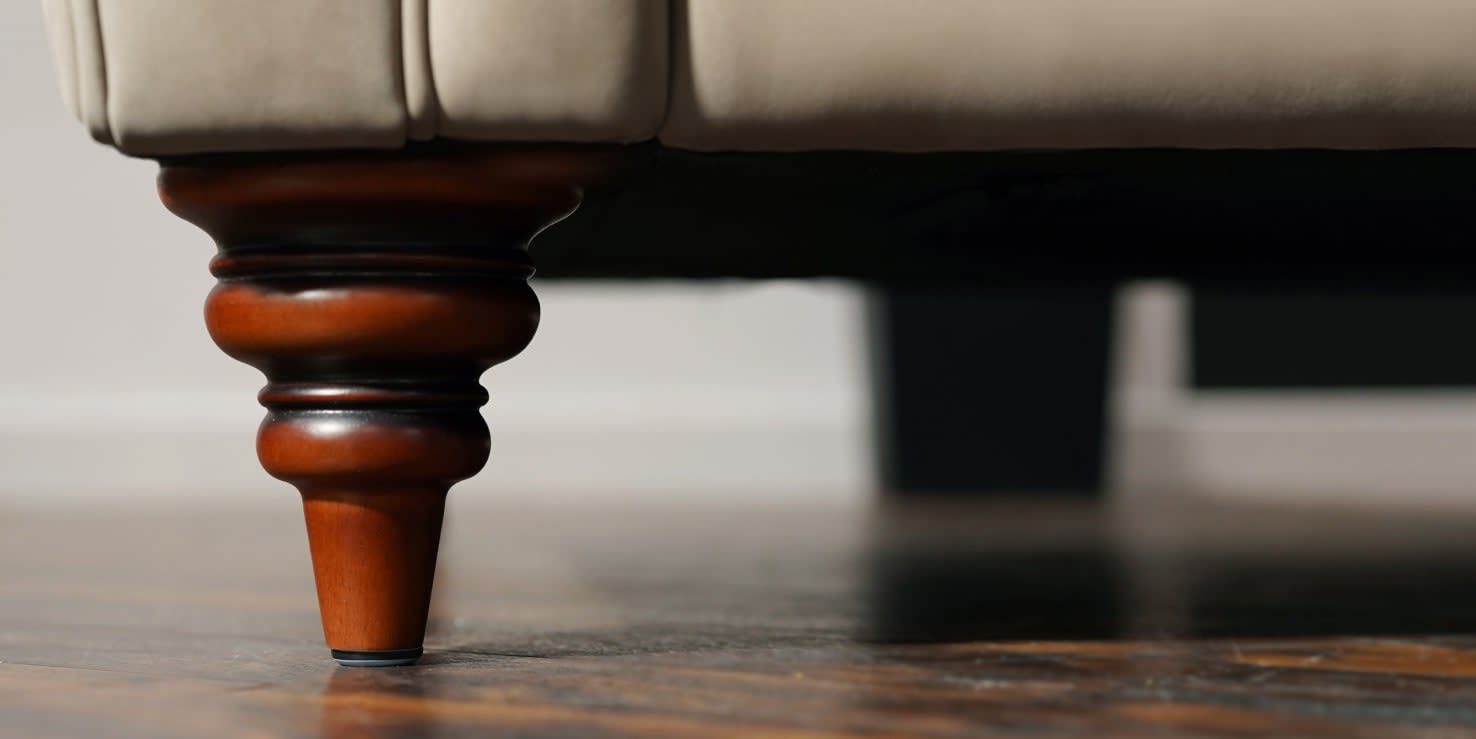 A zoomed in image of a sofa leg