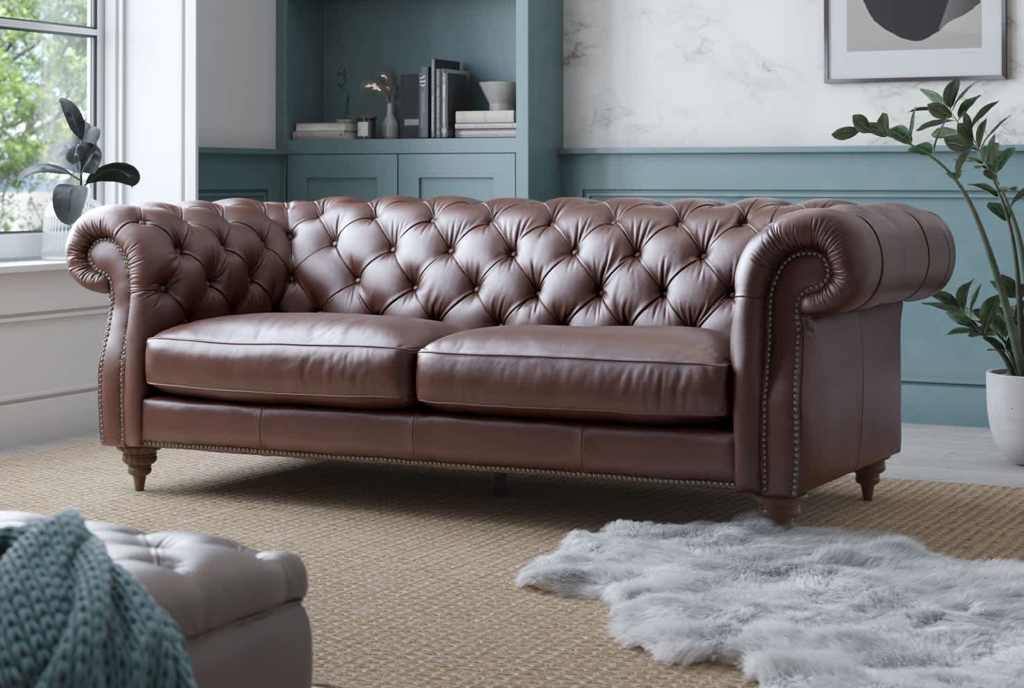 Brown leather sofa in a bright room