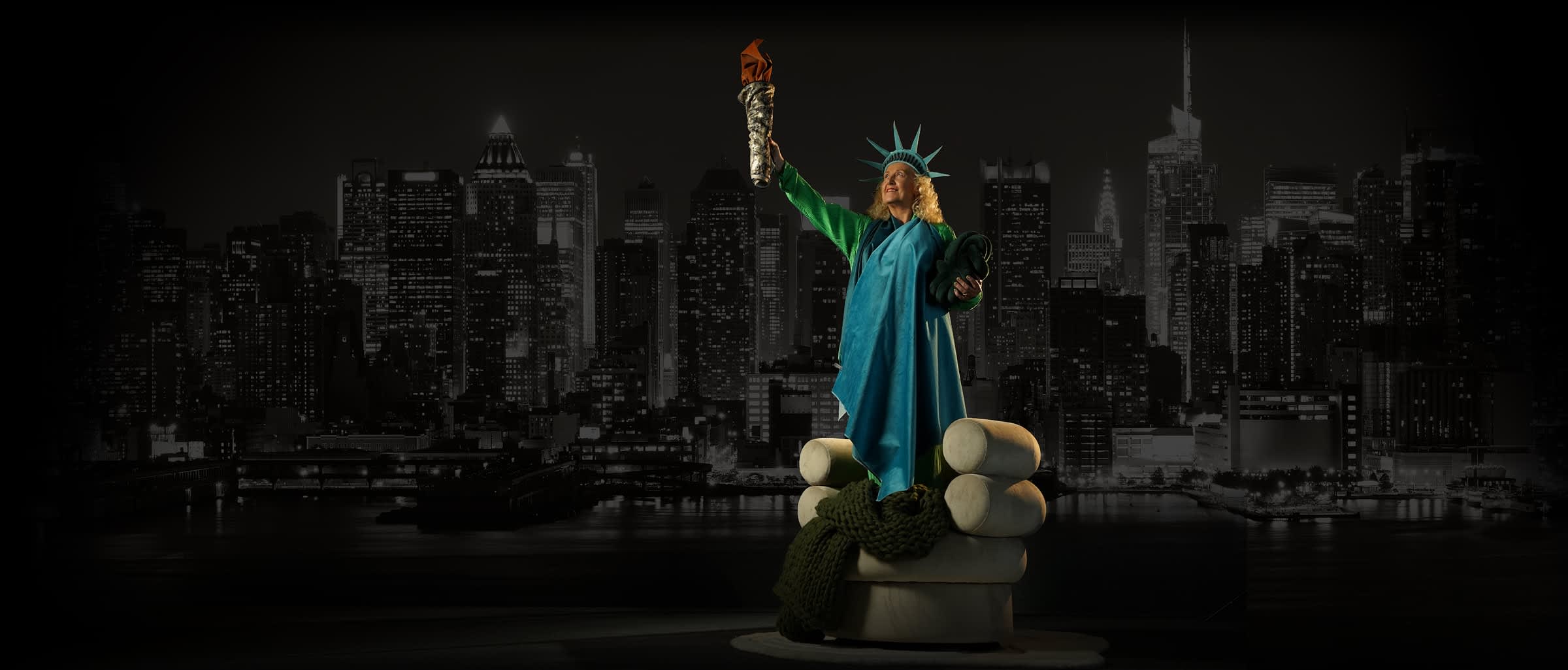 A woman dressed as the Statue of Liberty