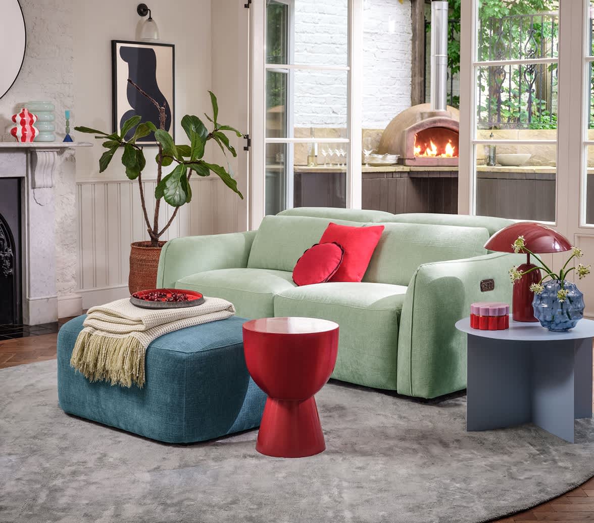 Blue colored sofa in a bright room.