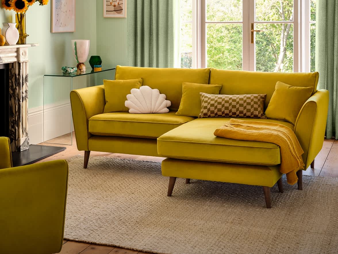 Yellow colored sofa in a bright room
