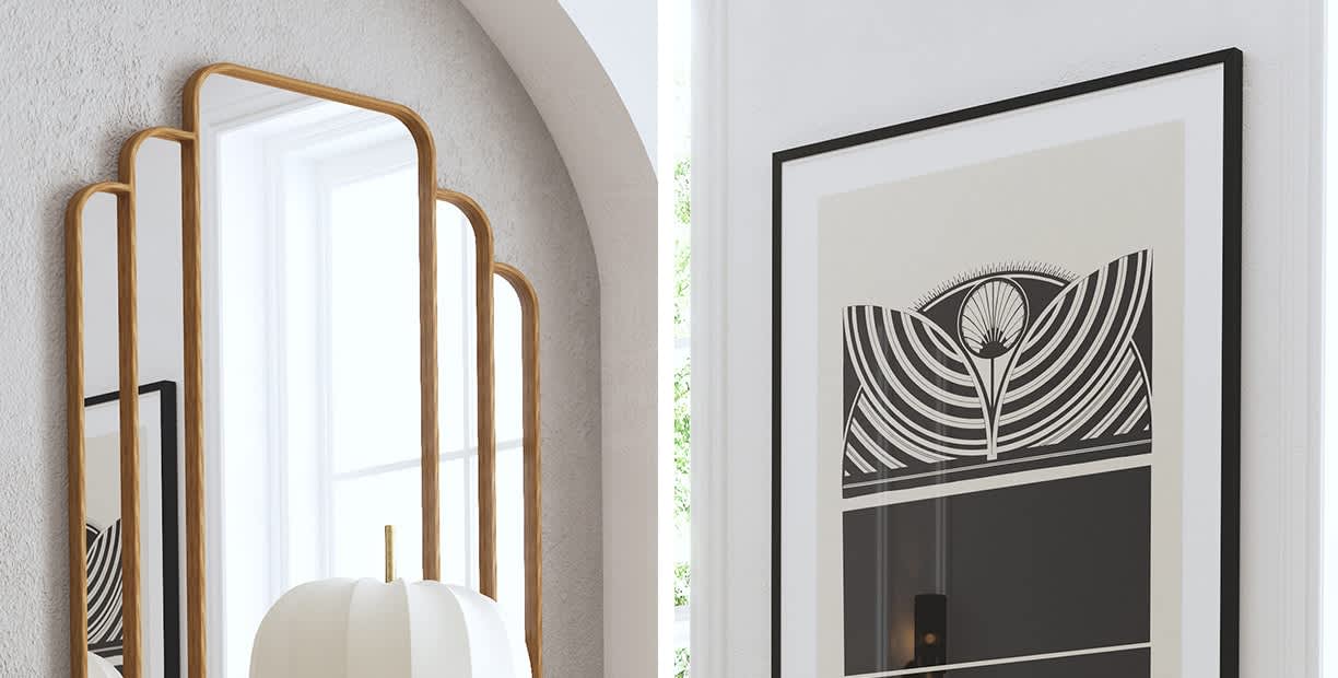 Image of a mirror and framed picture in a bright room