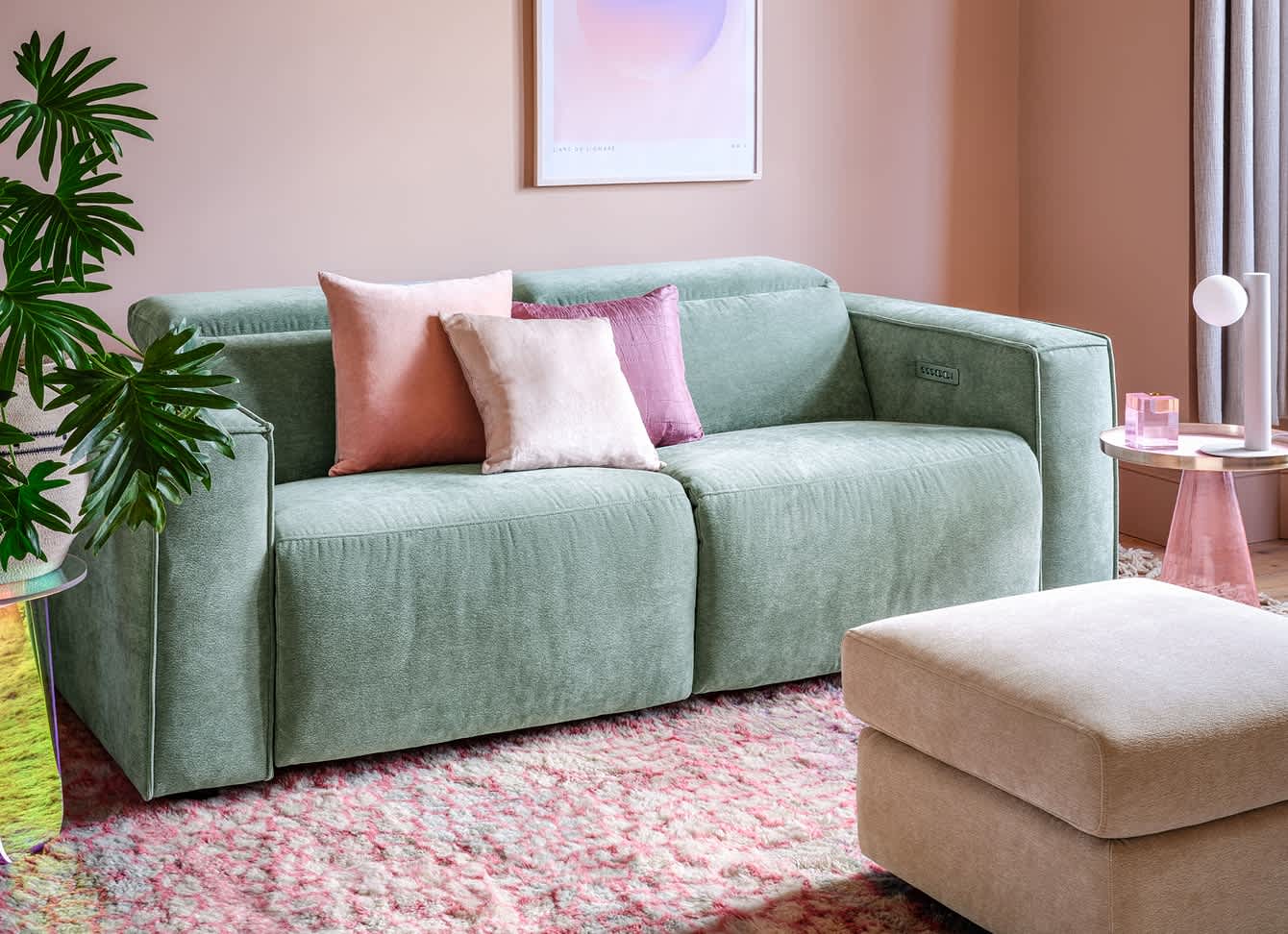 Pastel green sofa in a bright room
