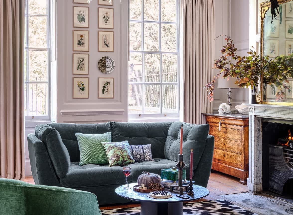 A dark blue sofa in a brightly lit room.