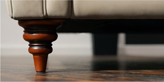 A zoomed in image of a sofa leg